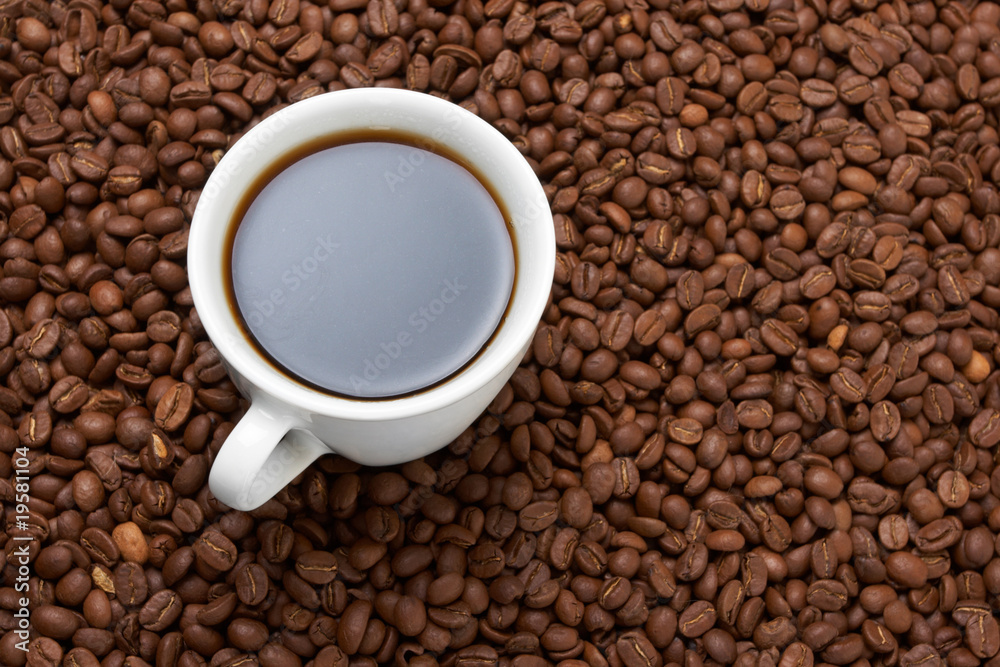 Cup with coffee, costing on coffee grain Cup with coffee, costing on coffee grain