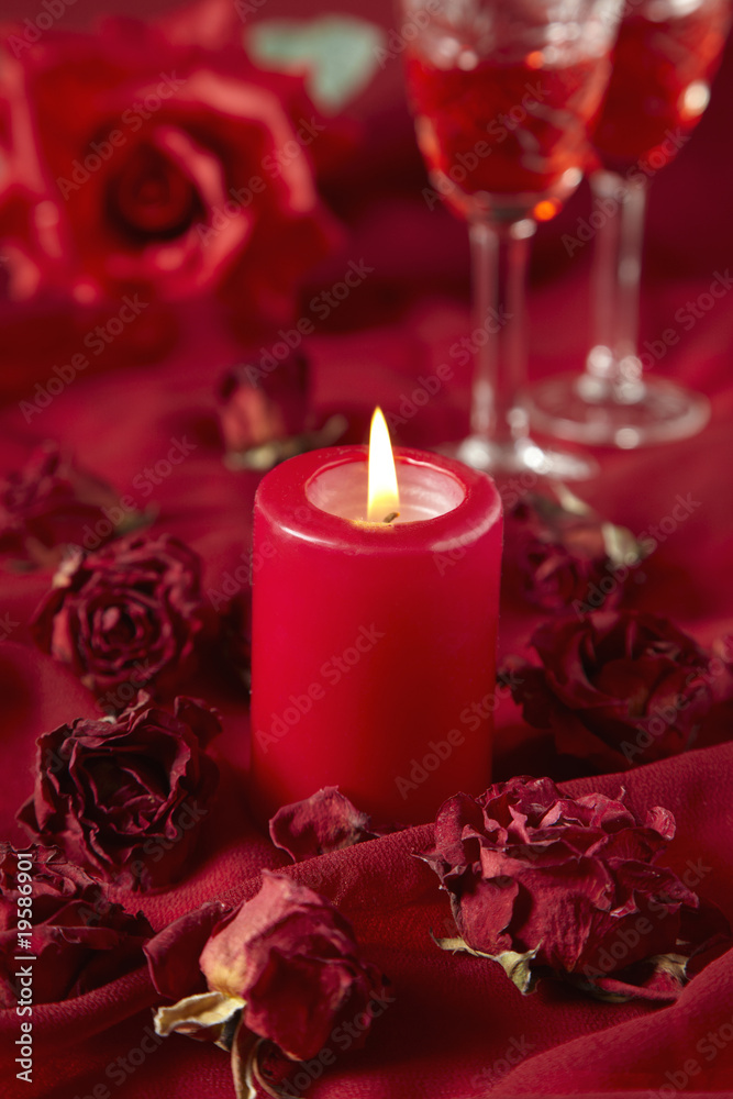 red roses and burning candle