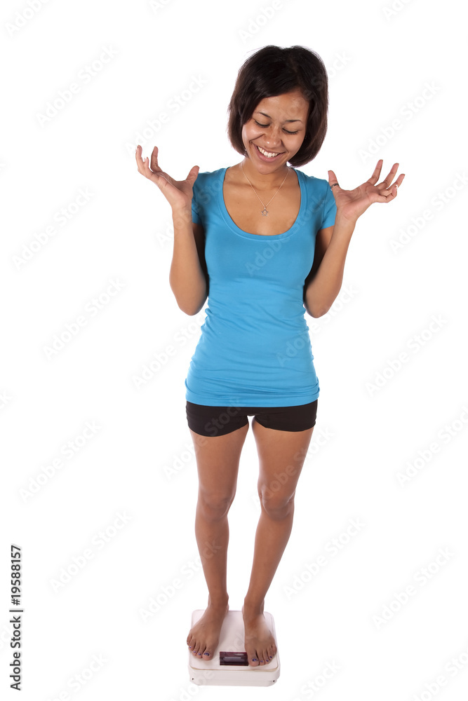 woman in blue on scales happy woman in blue on scales happy
