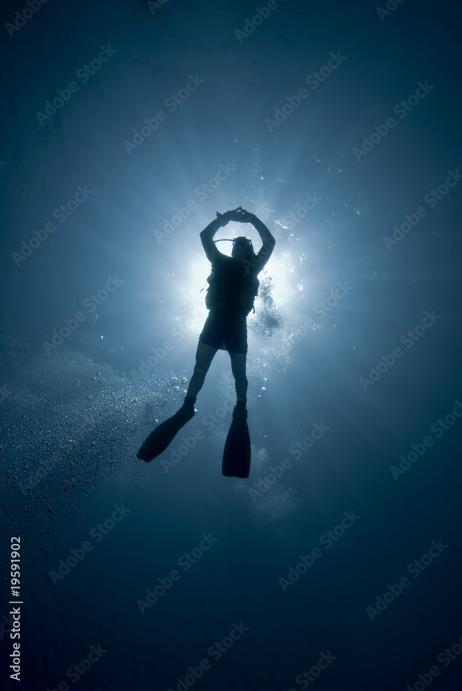 Scuba divers and sun Scuba divers and sun
