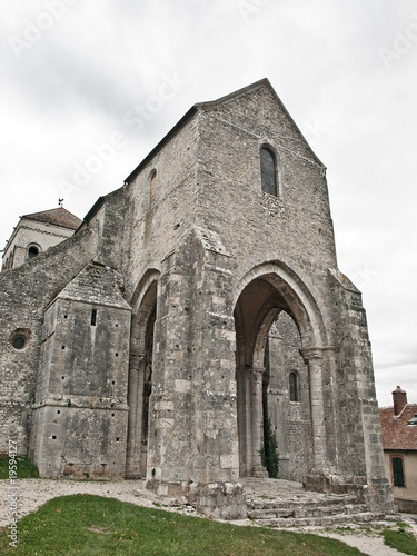Entrance of the XIII century church. France.