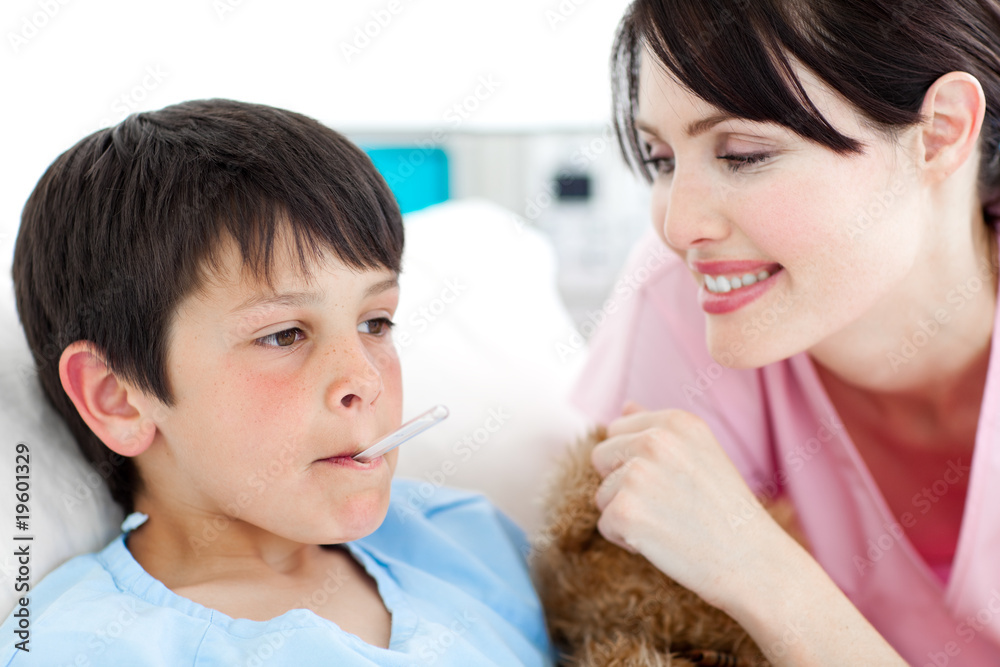 Smiling nurse taking her patient's temperature Smiling nurse taking her patient's temperature