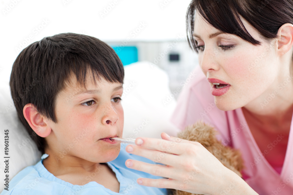 Caring nurse taking her patient's temperature Caring nurse taking her patient's temperature