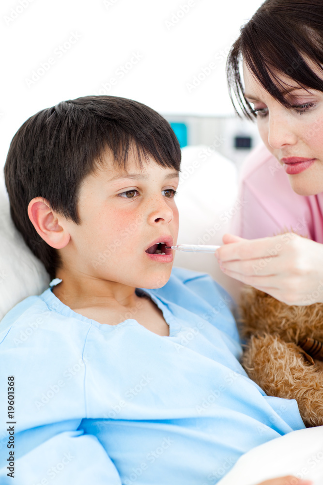 Young nurse taking her patient's temperature Young nurse taking her patient's temperature