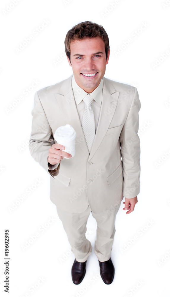 Attractive businessman holding a drinking cup Attractive businessman holding a drinking cup