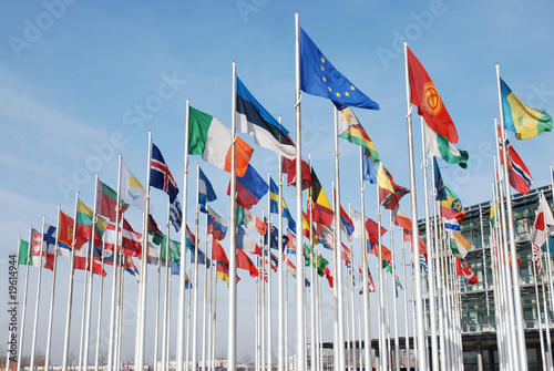 Flags of the world countrys in front of a business center