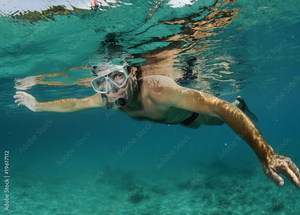 man snorkeler underwater