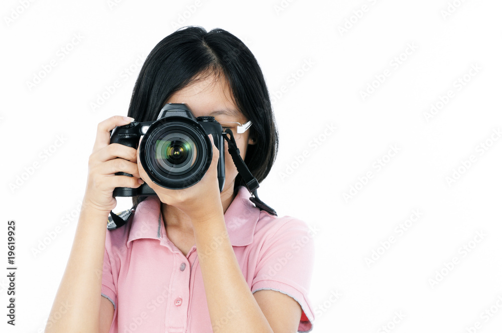 Young female photographer looking through a DSLR camera Young female photographer looking through a DSLR camera