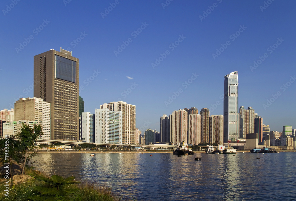 Business and residential buildings with harbour and vessel