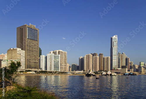 Business and residential buildings with harbour and vessel