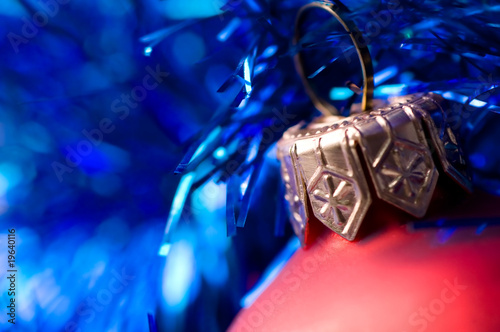 beautiful red bauble on blue christmas decoration