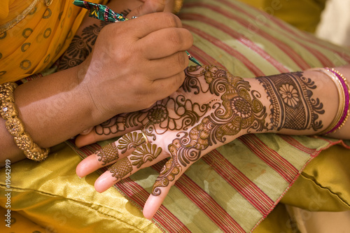 applying henna on hand, bride , traditional Hindu wedding , Rajasthan, India 