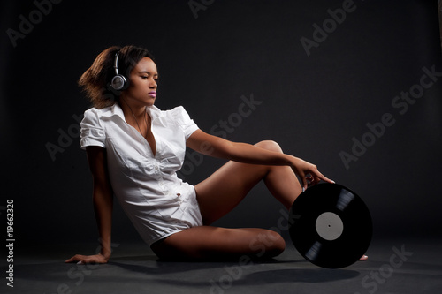 lovely woman in white shirt with vinyl