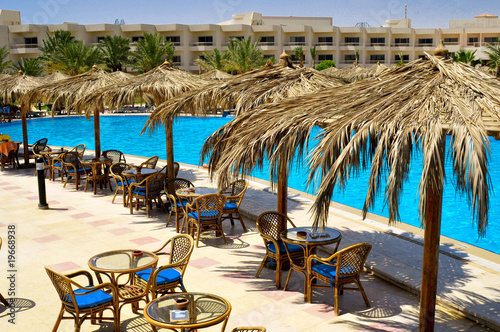 Tables beside the pool in the Egyptian hotel