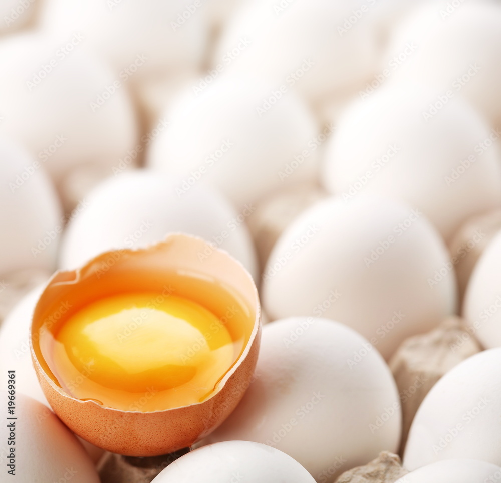 broken brown egg is among the whites of eggs. broken brown egg is among the whites of eggs.