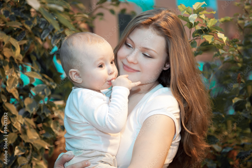 Beautiful baby in his mothers hands. Beautiful baby in his mothers hands.