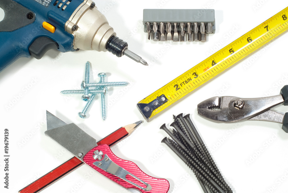 Screw driver with carpentry tools and pencil isolated on white Screw driver with carpentry tools and pencil isolated on white