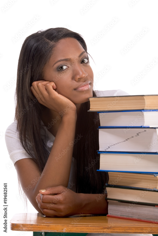 Black college student woman by stack of books Black college student woman by stack of books