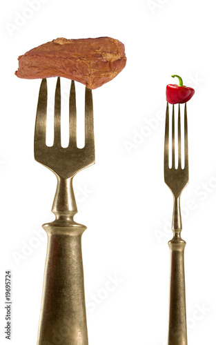Two fork with bacon and pepper.