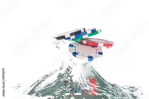 Poker chips jumping out of the clear water