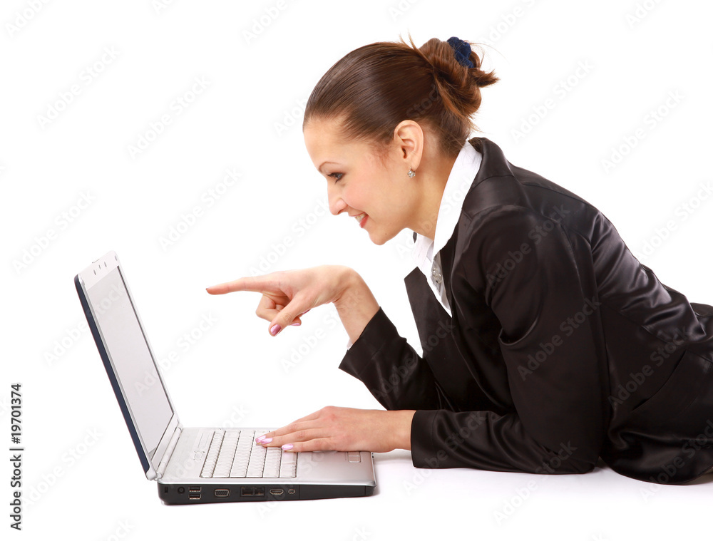 young woman is lying on the floor and working on a laptop. young woman is lying on the floor and working on a laptop.