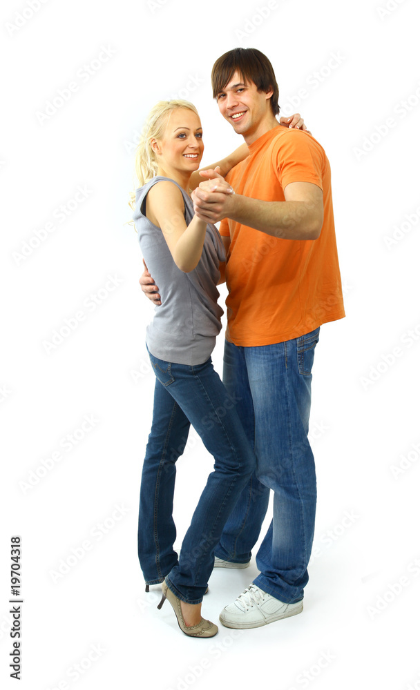 young couple in black attire dancing happily. young couple in black attire dancing happily.