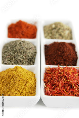 Fototapeta Naklejka Na Ścianę i Meble -  Spices in white container