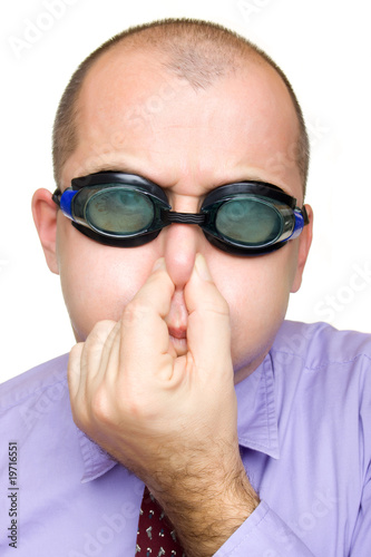 Funny businessman with swimming goggles