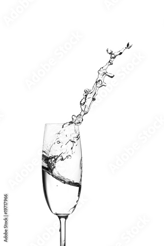 Water splashing out of a champagne glass