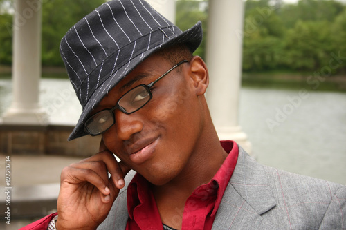 Man with hand on side of face