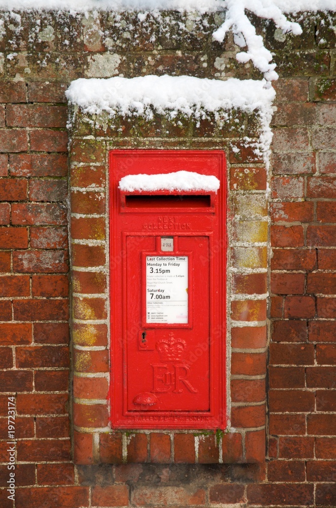 A british letter box in the winter snow A british letter box in the winter snow