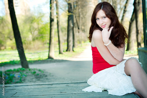 Romantic young woman relaxing outdoors