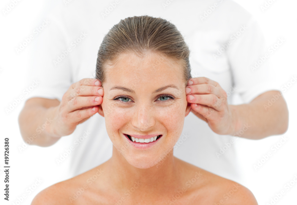 Smiling woman having a head massage in a spa Smiling woman having a head massage in a spa