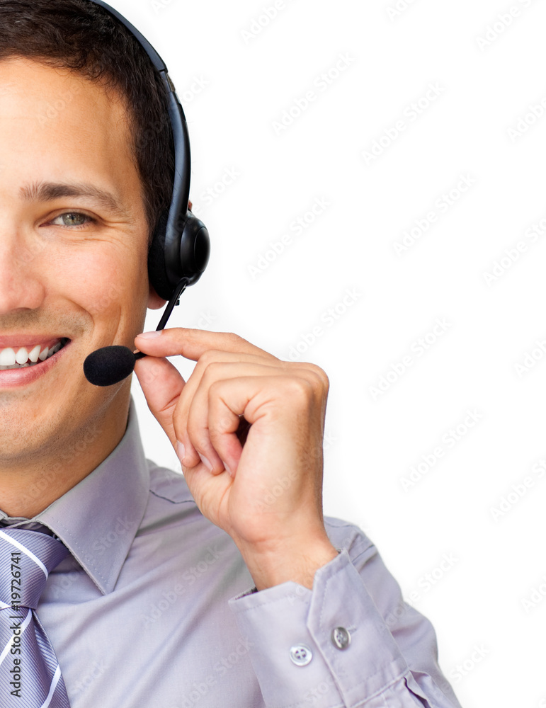 Close-up of a businessman using headset Close-up of a businessman using headset