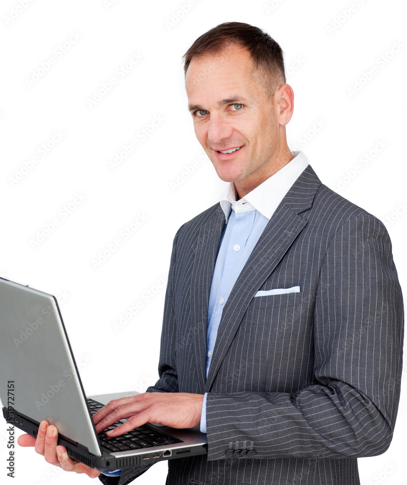 Charismatic businessman using a laptop Charismatic businessman using a laptop