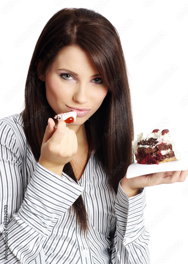 Young beautiful woman with a cake. Close-up studio portrait. is