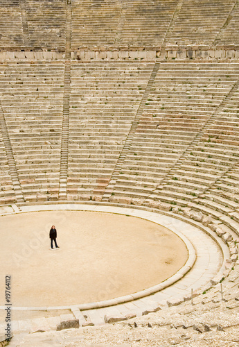Tourist in ancient theater in Epidaurus, Greece