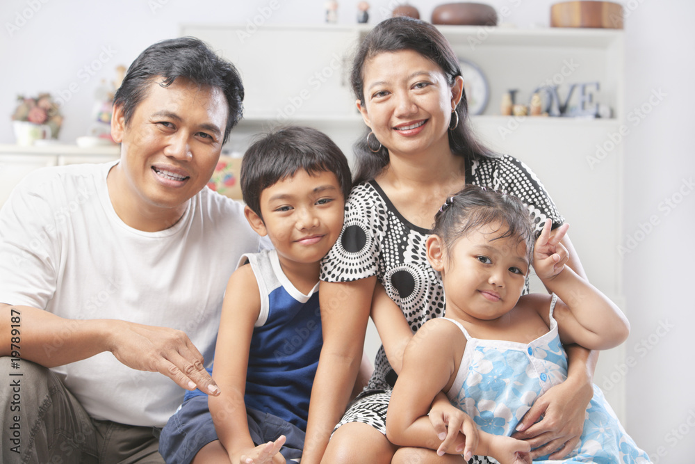 Asian family posing at home