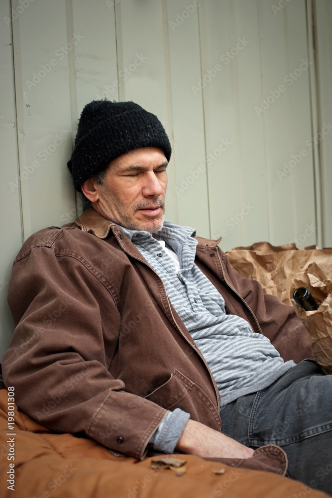 Sleeping Homeless Man with Wine Bottle in a Sack Sleeping Homeless Man with Wine Bottle in a Sack
