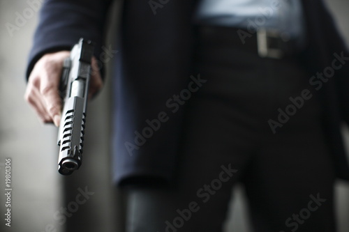 Man holding a .45 caliber gun