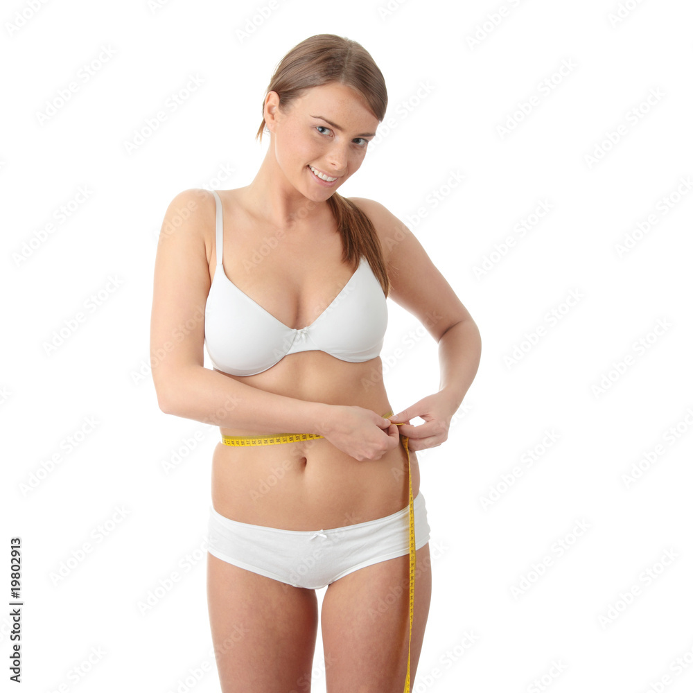 Young beautiful woman with measure tape