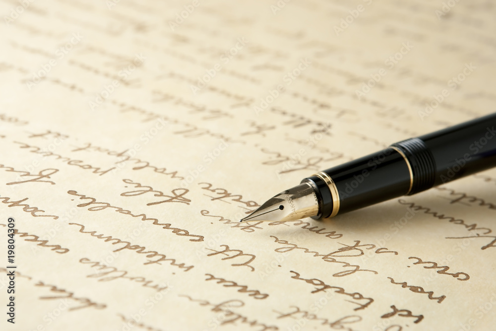 Gold Fountain Pen on Written Page Gold Fountain Pen on Written Page