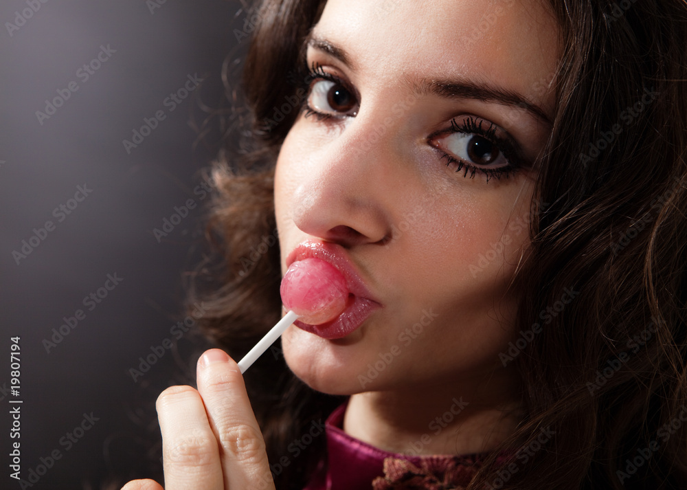 Fototapeta premium Girl with lollipop