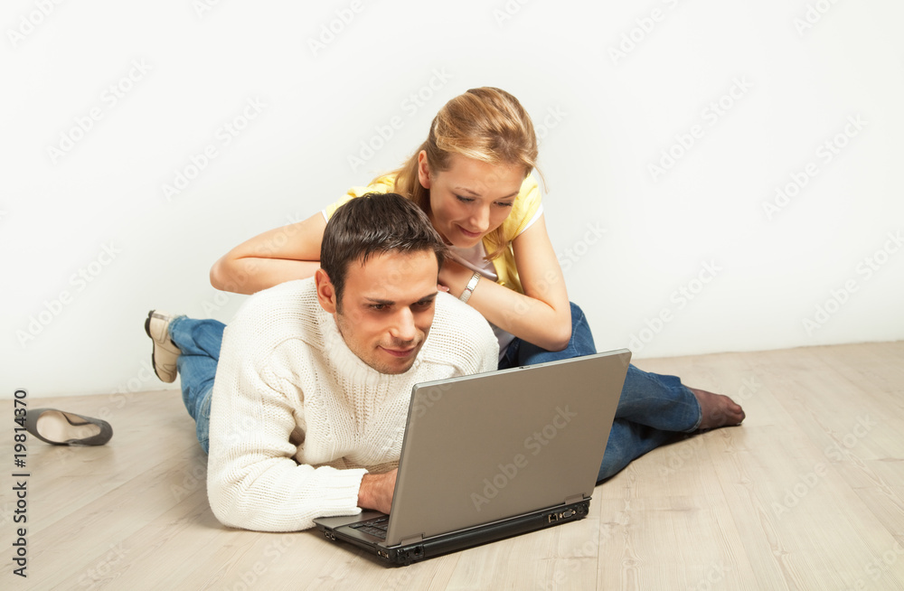 Relaxed couple with laptop computer