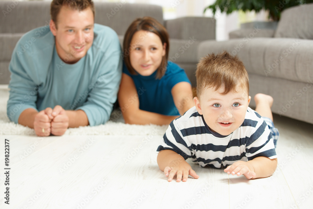 Family lying on carpet Family lying on carpet