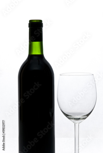 bottle of wine and wineglass isolated on white background