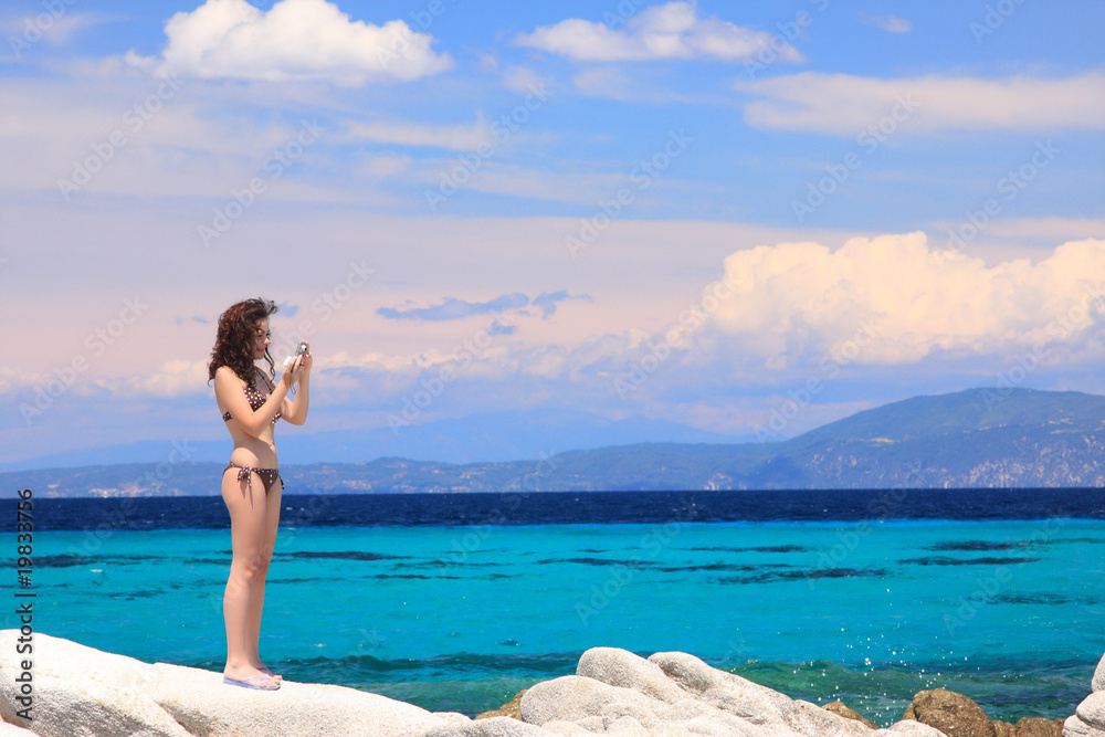 beautiful model relaxing on a beach in Greece beautiful model relaxing on a beach in Greece