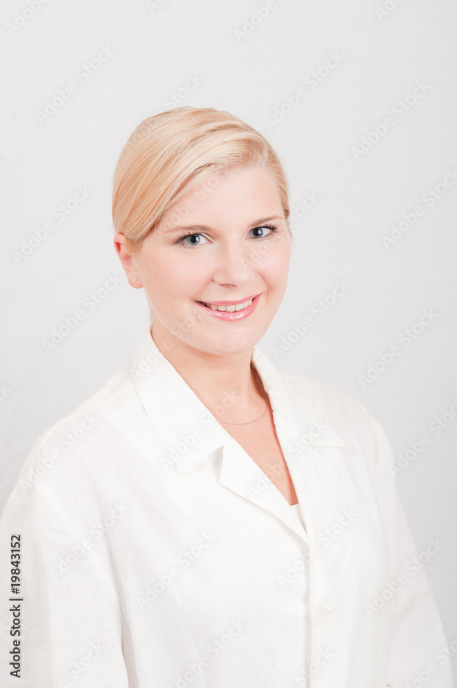 Young female doctor in white uniform Young female doctor in white uniform