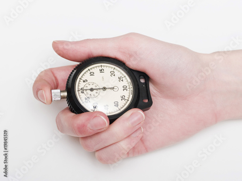 female hand holding the stop-watch