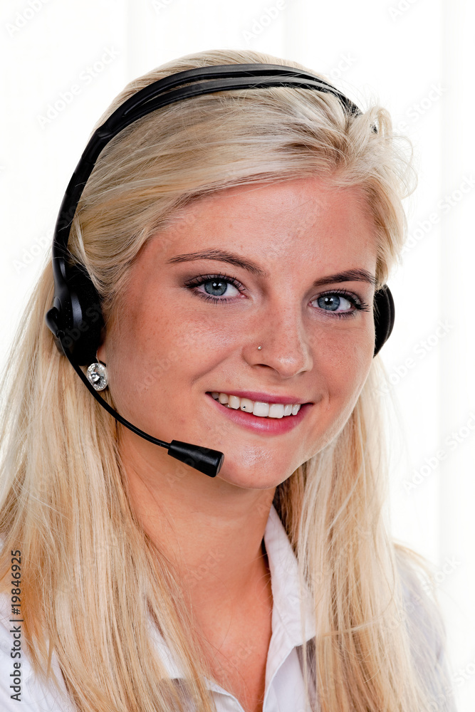 Woman with telephone headset in a call center Woman with telephone headset in a call center